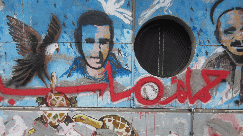 DesGraffiti sur la rue Mohamed Mahmoud au Caire, où des manifestations ont été réprimées dans le sang en novembre 2011 © Amnesty International