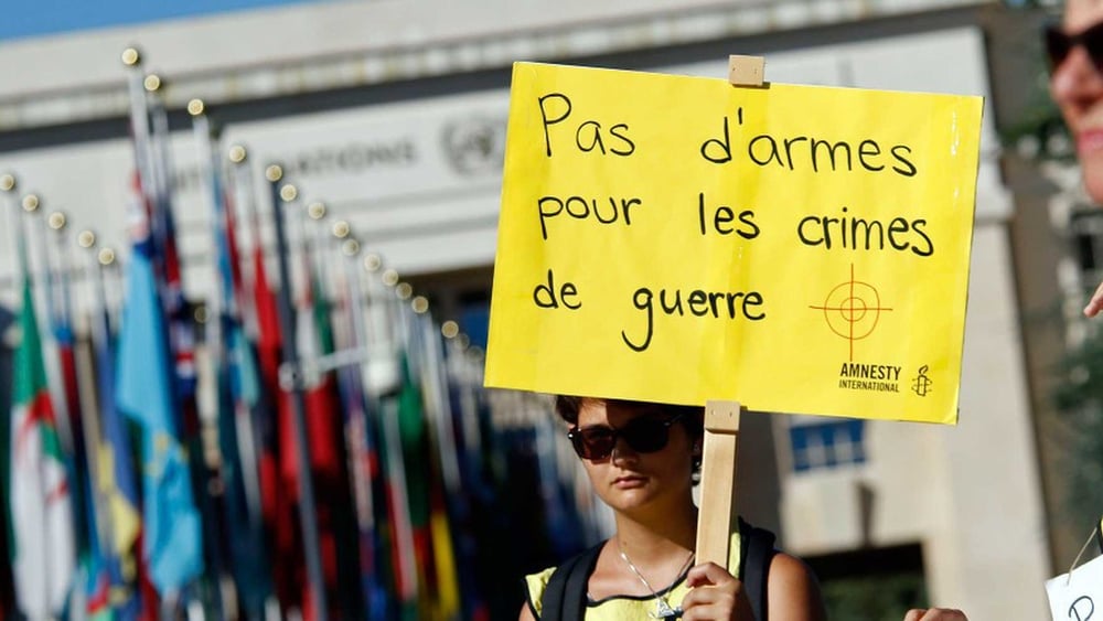 Des activistes et délégué·e·s d'ONG du monde entier ont demandé, lors de la conférence du Traité sur le commerce des armes en août 2016 à Genève, une stricte application du texte.  © AI / Samuel Fromhold