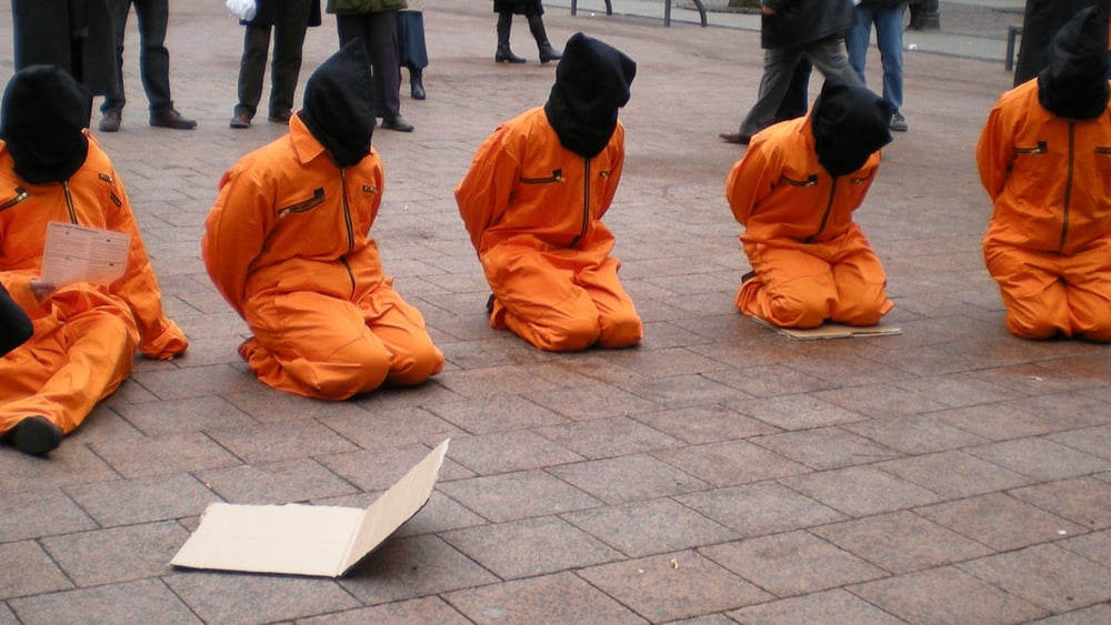 Action de protestation demandant la fermeture du centre de détention de Guantanamo. © Amnesty International