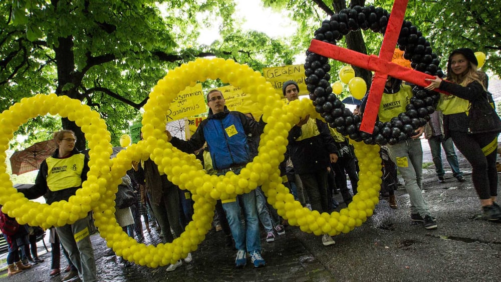 «Cinque anelli per Rio. Una fiamma per i diritti umani» © Klaus Petrus