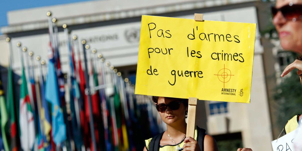 Des activistes et délégué·e·s d'ONG du monde entier ont demandé, lors de la conférence du Traité sur le commerce des armes en août 2016 à Genève, une stricte application du texte.  © AI / Samuel Fromhold