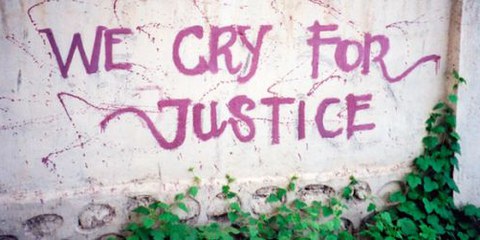 Un graffiti au Timor oriental: les victimes demandent justice. © AI