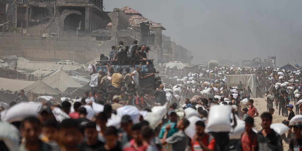 Distribution de biens humanitaires dans la ville de Gaza, le 27 juillet 2025. © Khames Alrefi/Anadolu via Getty Images