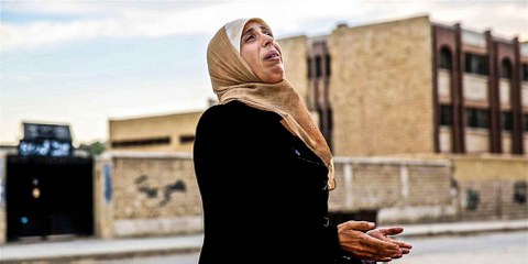Durant quatre ans, Carsten Stormer a été l'un des rares journalistes à se rendre en Syrie et à en rapporter des comptes rendus de première main. Une femme à Alep, décembre 2013. © Carsten Stormer